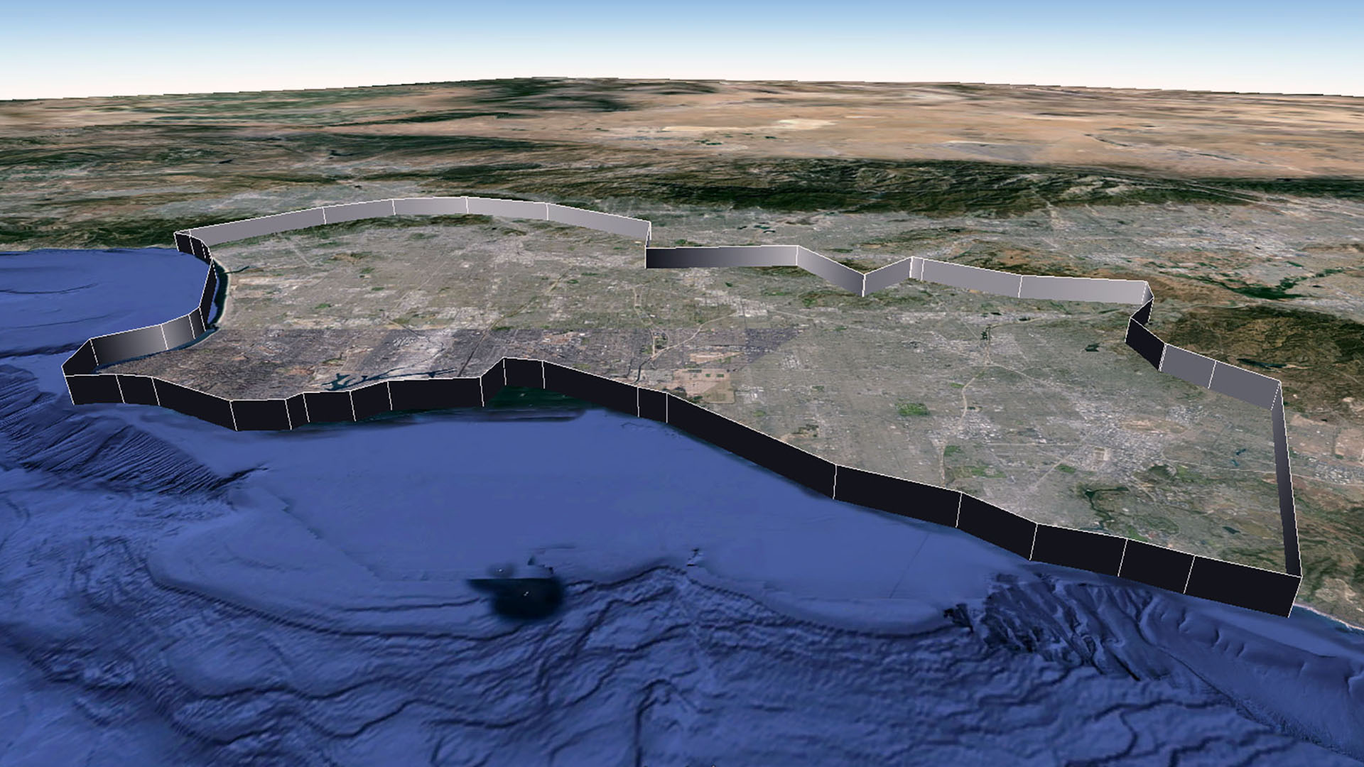 The Frontier of Resolution, here visualized as a wall about 1,500 meters in height, straddles the border between Los Angeles and Orange Counties in Southern California. Judging from Google’s initial promotional material release, Los Angeles was among the first four cities to be digitally modeled using the stereophotogrammetry process. As such, the frontier is brazen in its divisions, and can be described with a spartan 49 placemarks (compare to the later completed model of Chicago, which requires 419 placemarks to trace its edge).